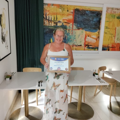 Debbie holding her award